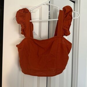 Cute dark orange flare sleeves crop top! It’s from Cider in a size small!